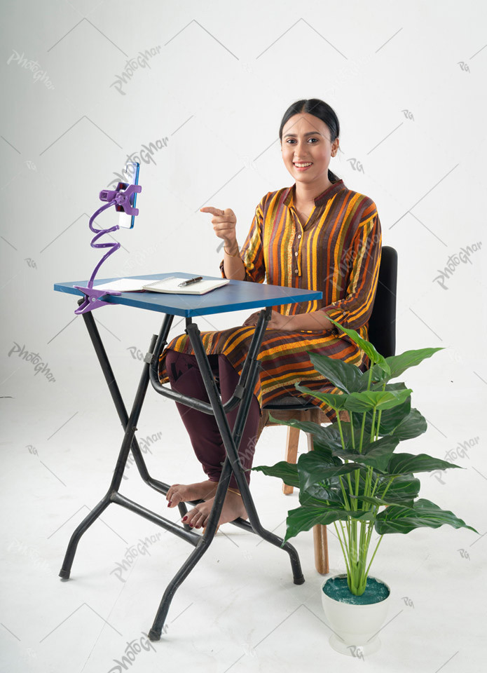 Female student pointing to the smartphone