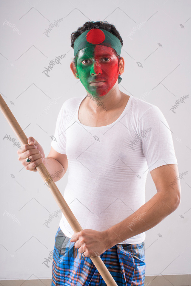 Flag painted man holding stick