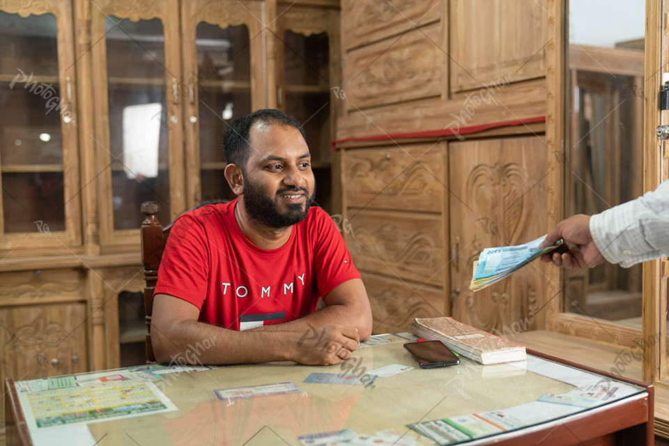 Furniture businessman collecting money