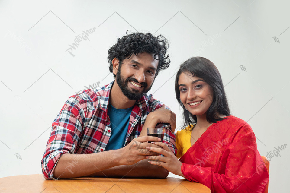 Girlfriend and boyfriend holding tee glass cup