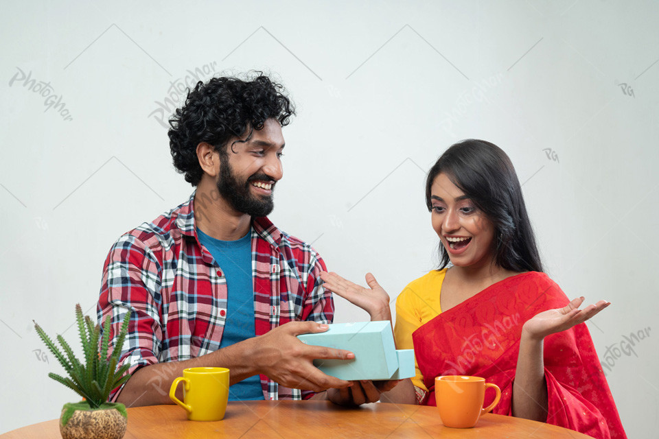 Happy Couple Exchanging Gifts