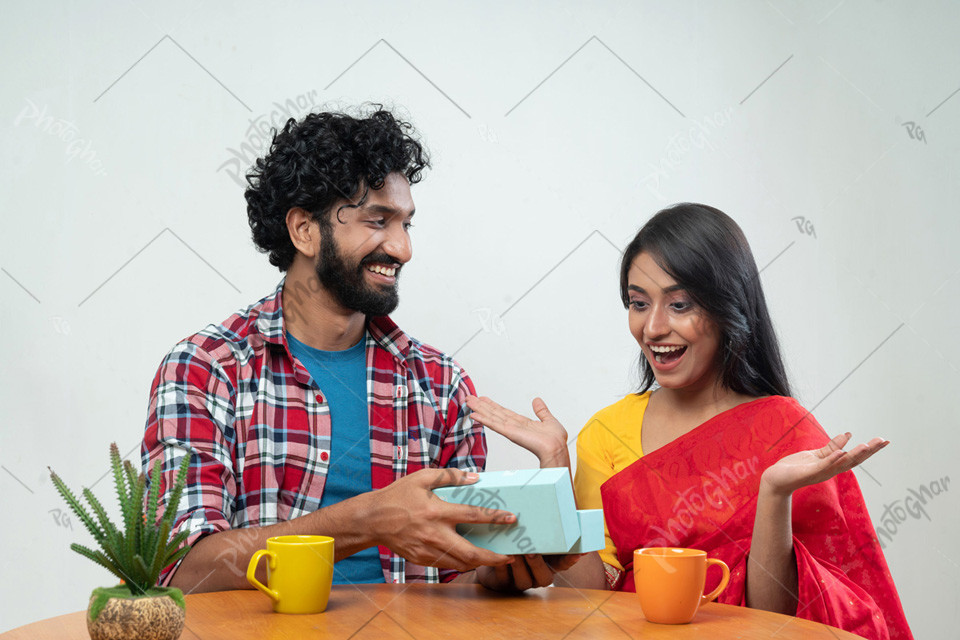 Happy Couple Exchanging Gifts