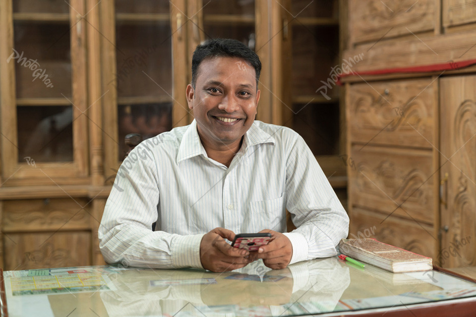 Happy Shopkeeper of a rural furniture store