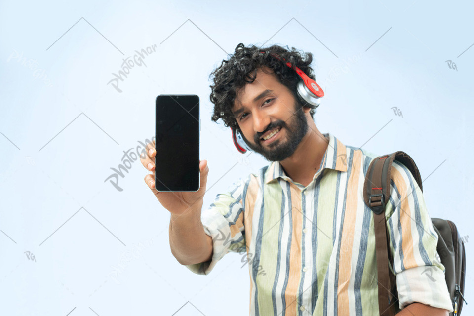 Happy college student showing mobile