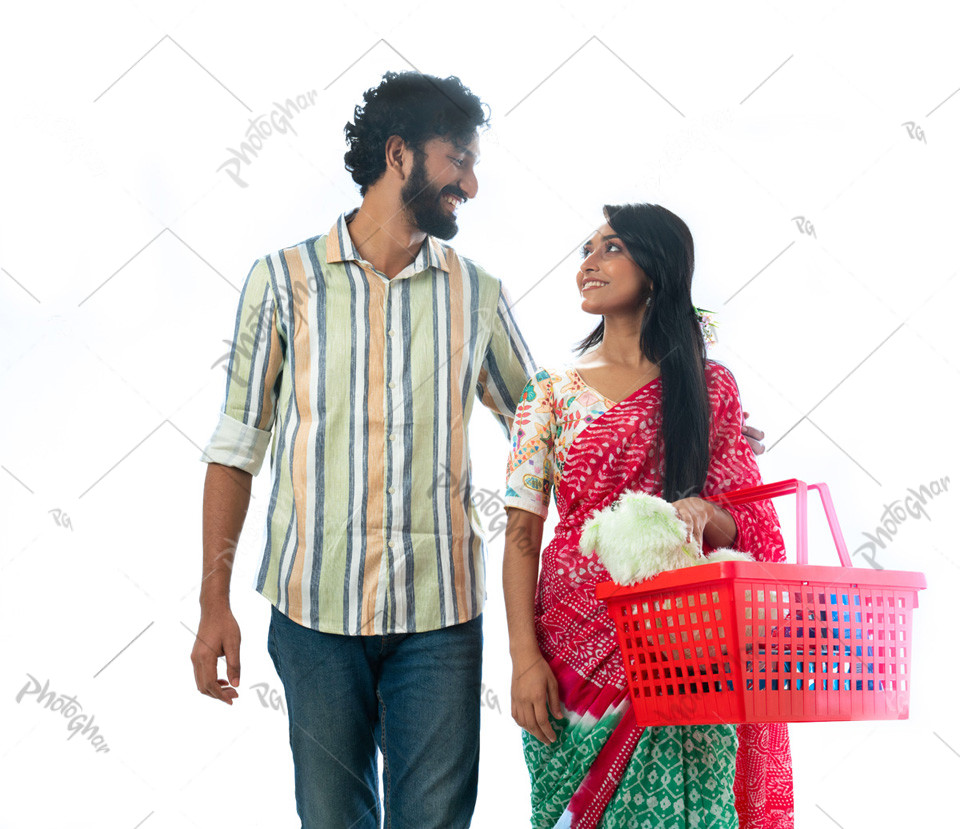 Happy couple holding shopping basket