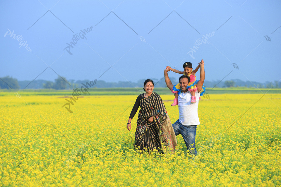 Happy family in mustard field