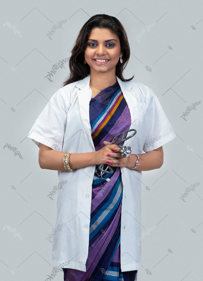 Happy female doctor holding stethoscope