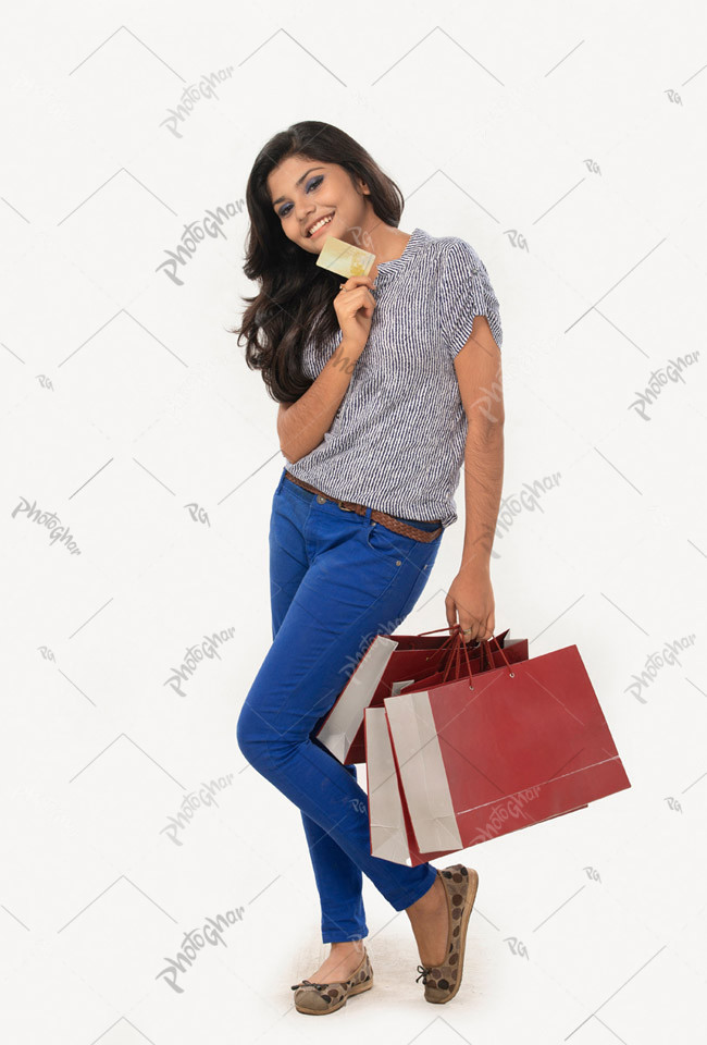 Happy girl Showing Bank Card and Shopping Bags