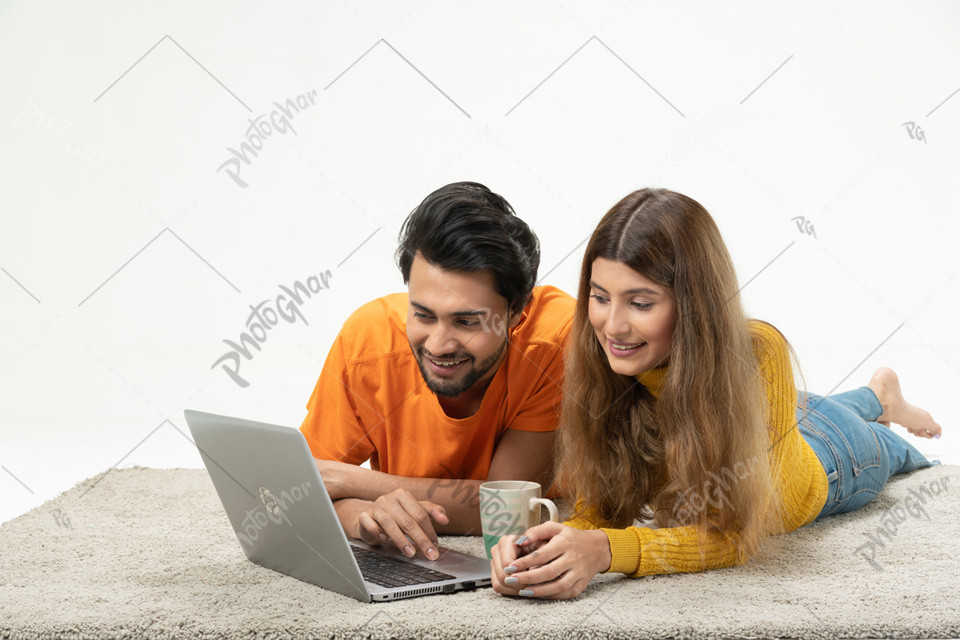 Happy husband wife using laptop