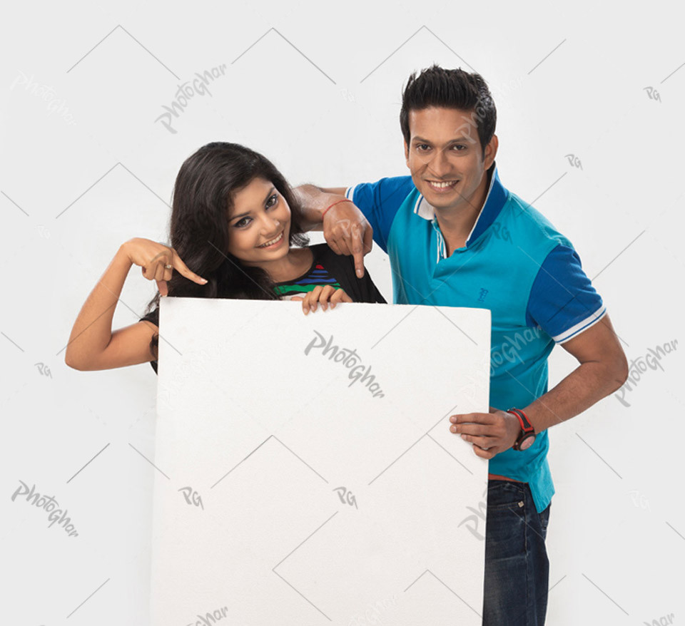 Happy moment of beautiful couple holding placard