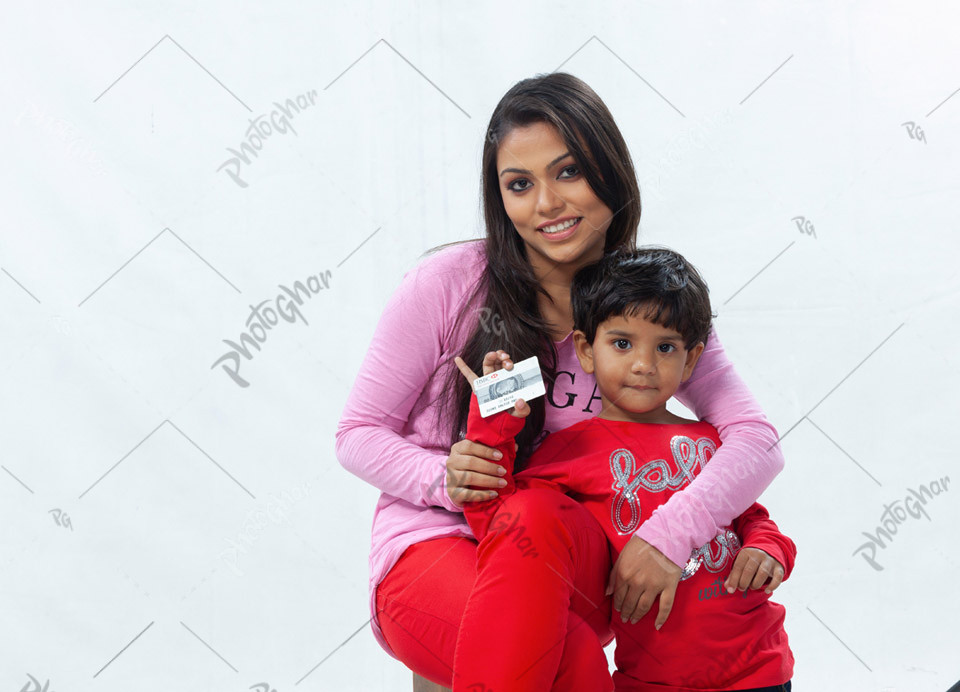 Happy mother daughter showing bank card