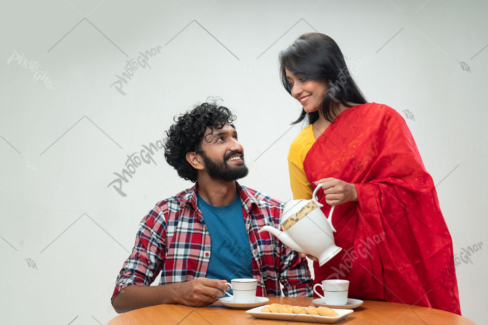 Happy new married couple having breakfast