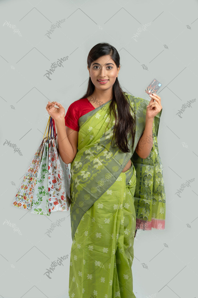 Happy shopping lady customer showing card