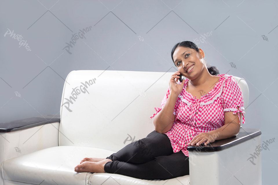 Happy smiling housewife talking on phone