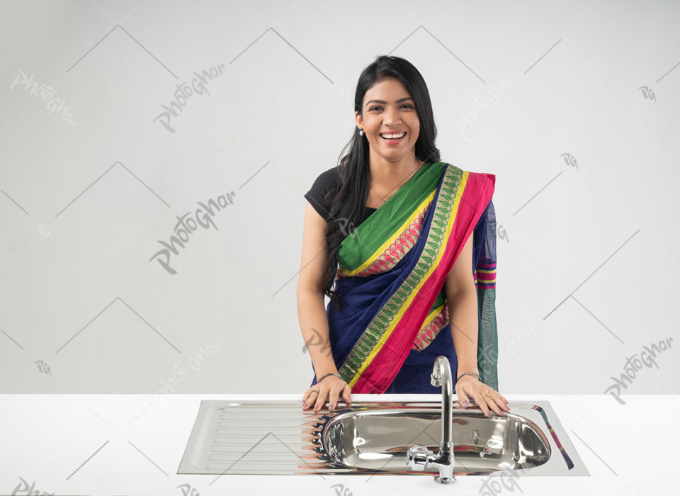 Happy smiling housewife with clean basin