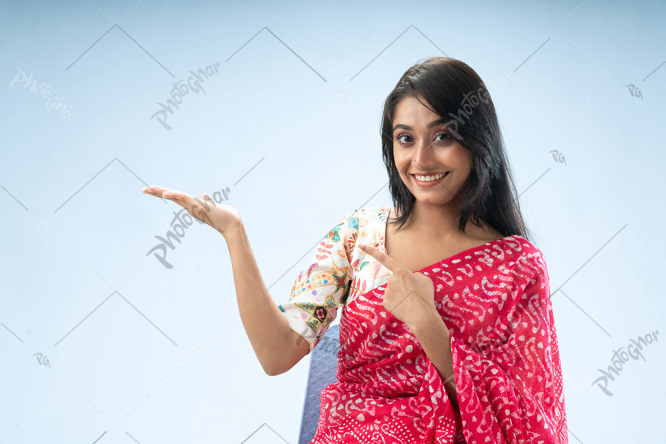 Happy woman pointing confidently