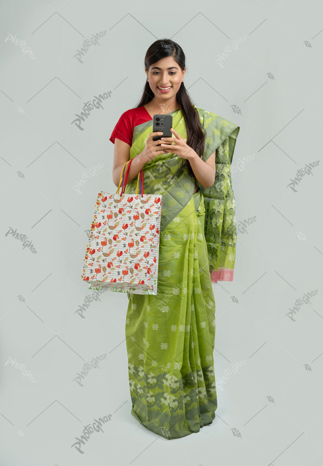 Happy woman using phone to pay online