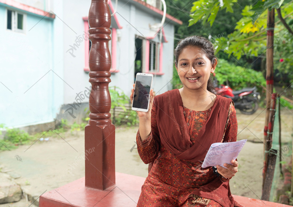 Happy young girl displaying mobile screen