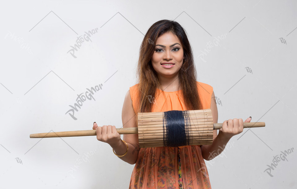 Happy young girl holding manjha