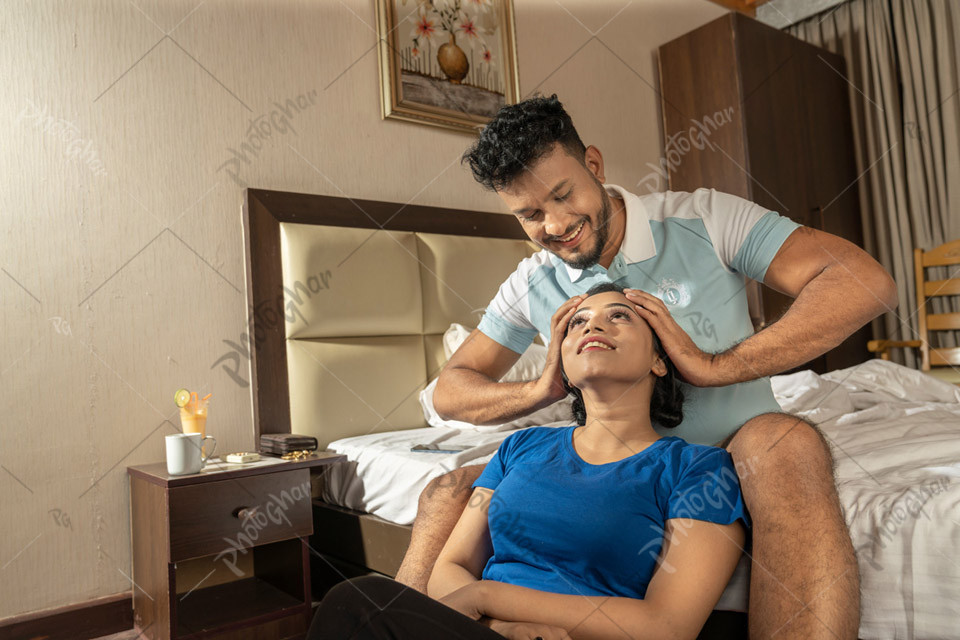 Honeymoon Couple Enjoying in Hotel Room