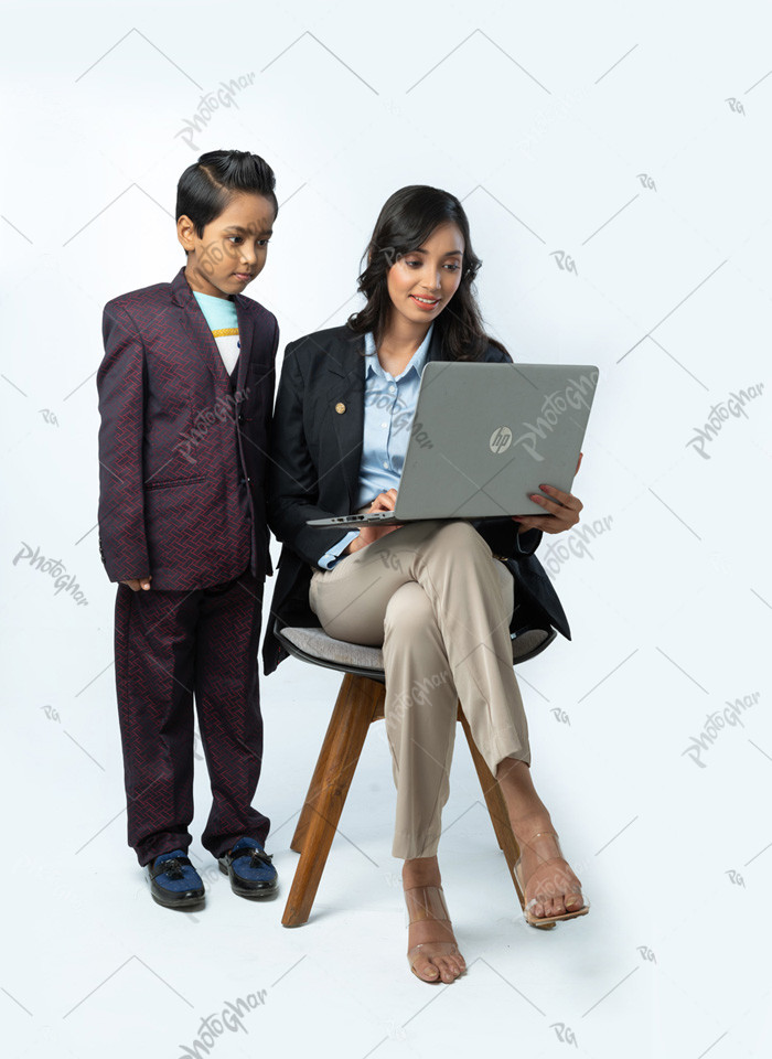 Housemother and son looking at monitor screen