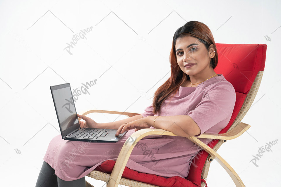 Housemother freelancing with laptop