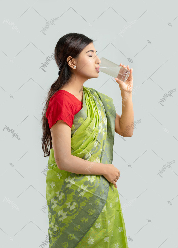 Housewife drinking clean glass water