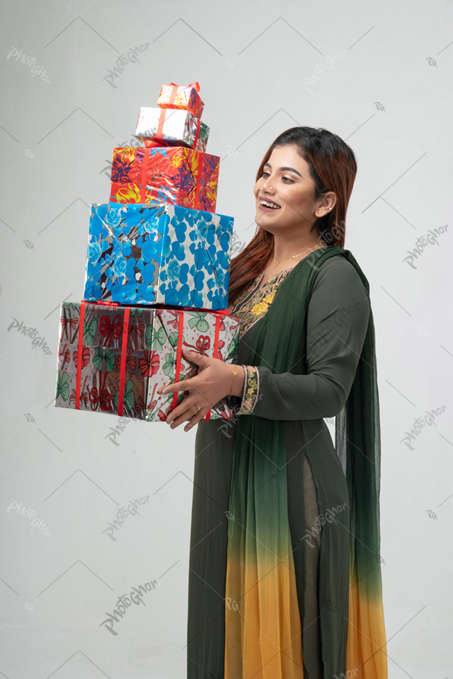 Housewife holding multiple gift