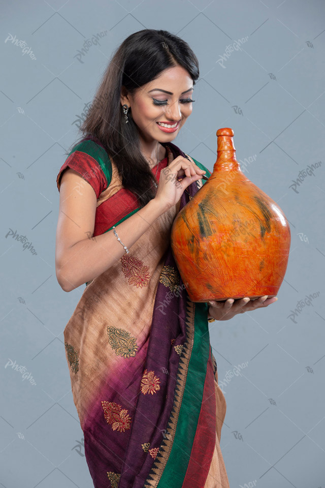 Housewife putting coin into piggy bank