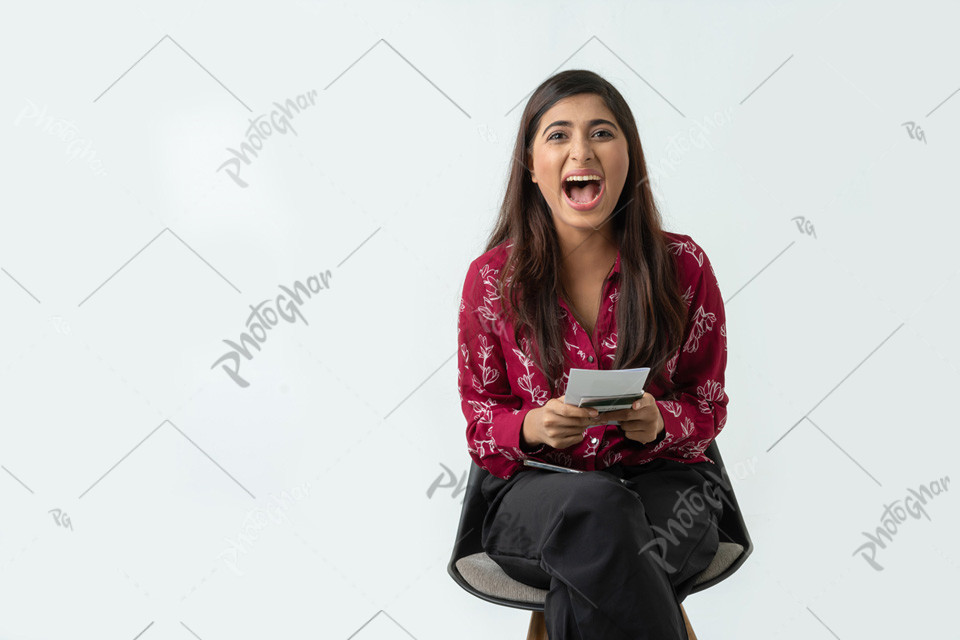 Joyful woman displays air ticket