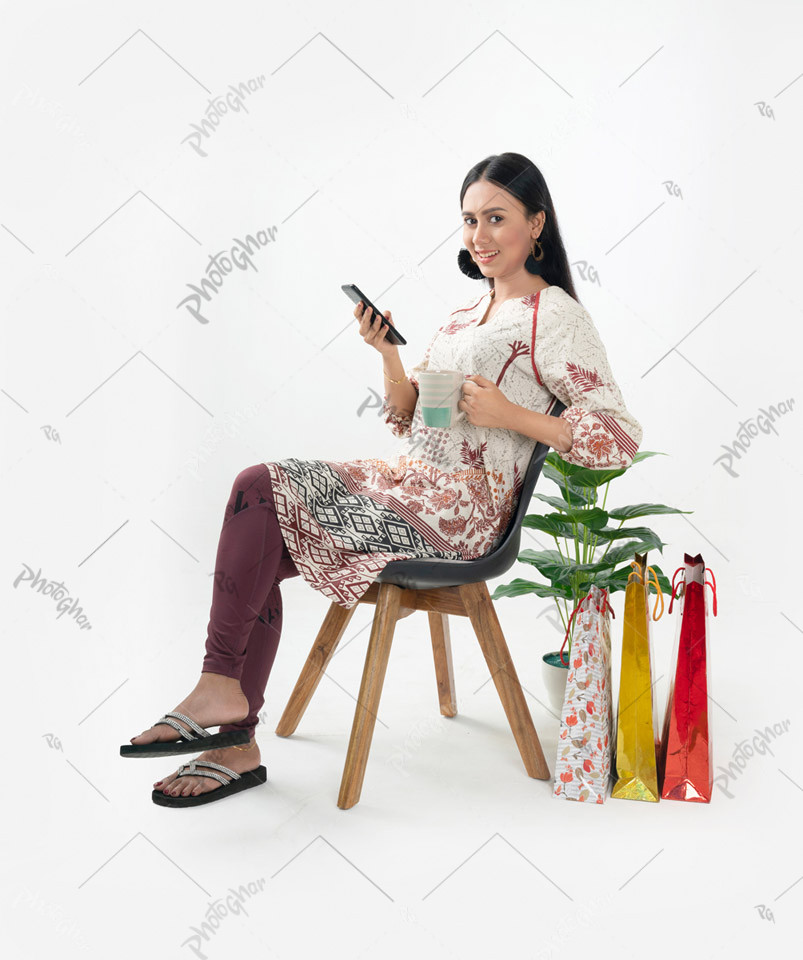 Joyful young adult woman completing online payment