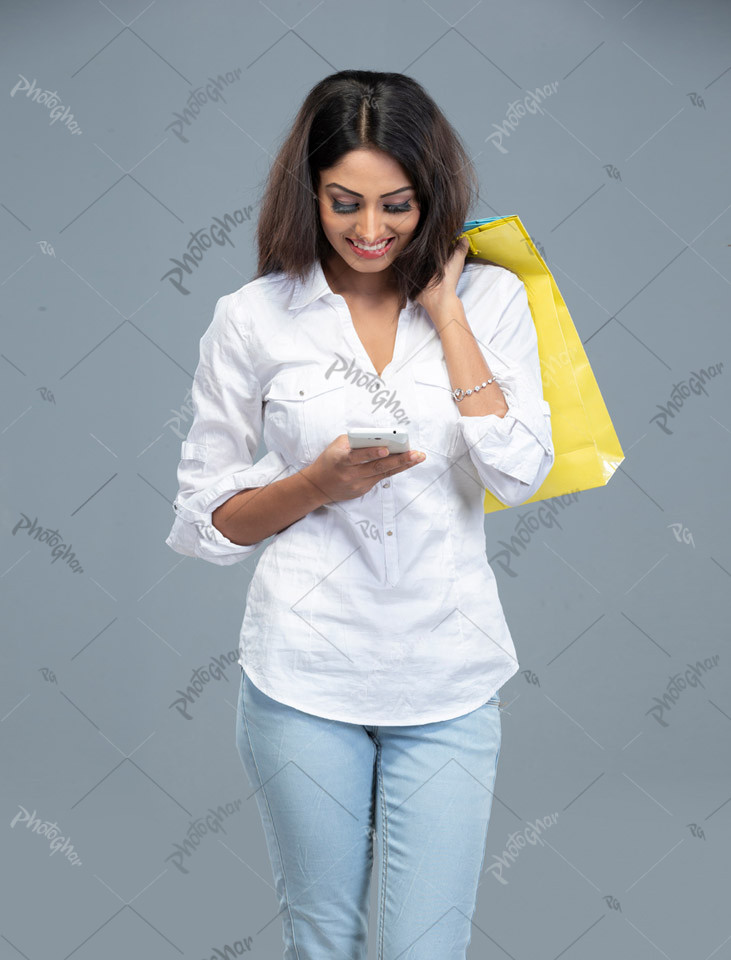 Joyful young woman completing online payment