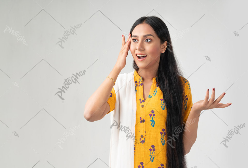 Joyful young woman with surprised expression