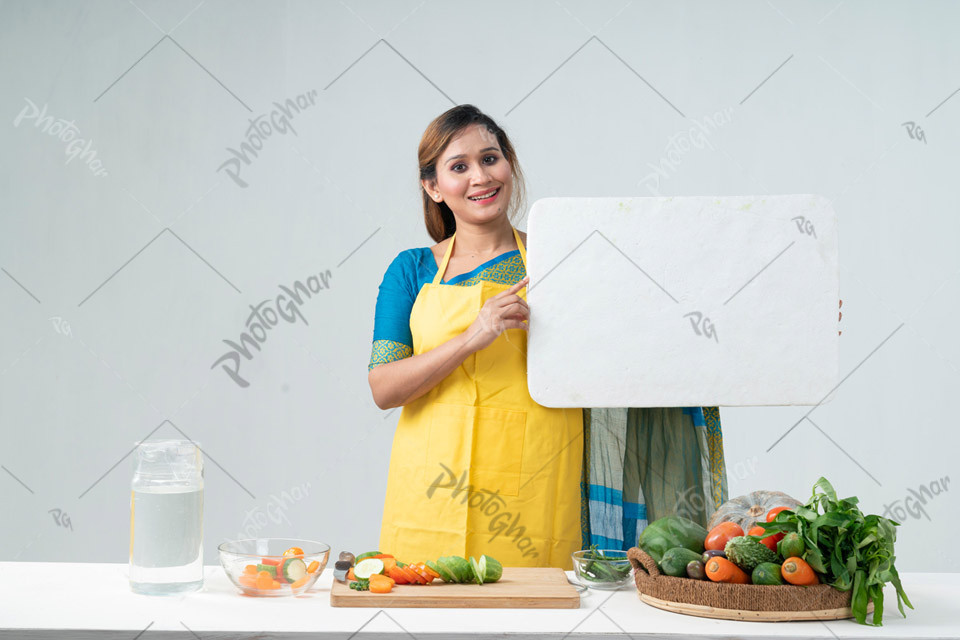 Kitchen woman holding signboard