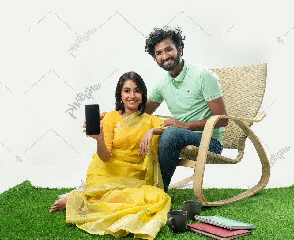 Loving Girlfriend and boyfriend showing mobile screen