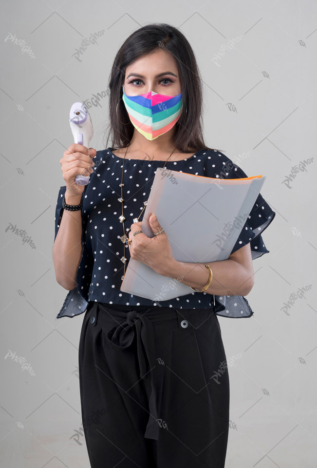 Masking wear woman employee holding thermometer