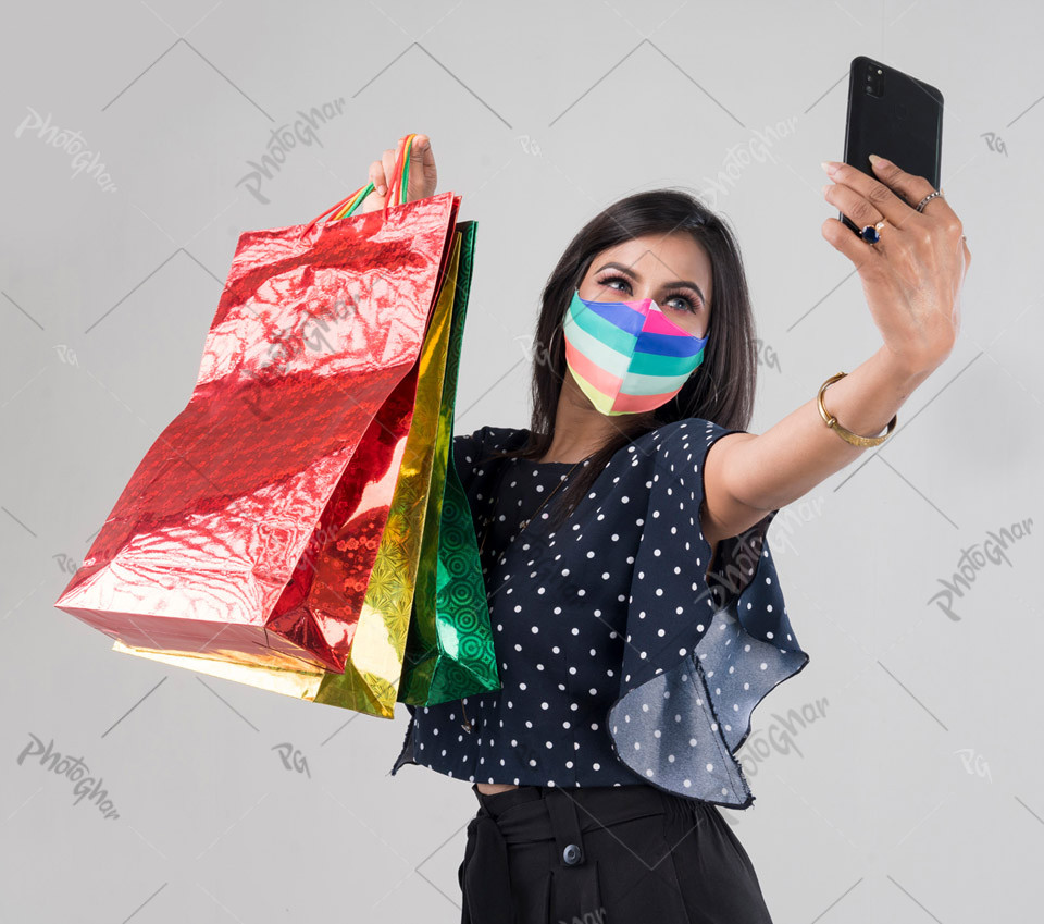 Masking wear woman shopper taking selfie