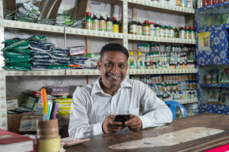 Middle adult man in Bangladesh selling pesticides