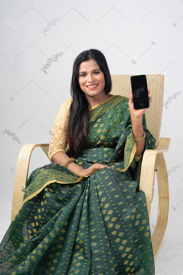 Middle class housewife displaying mobile screen