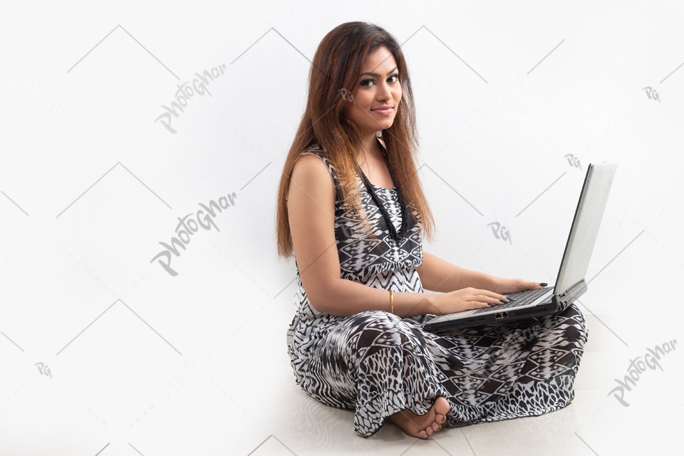 Modern young lady holding smartphone