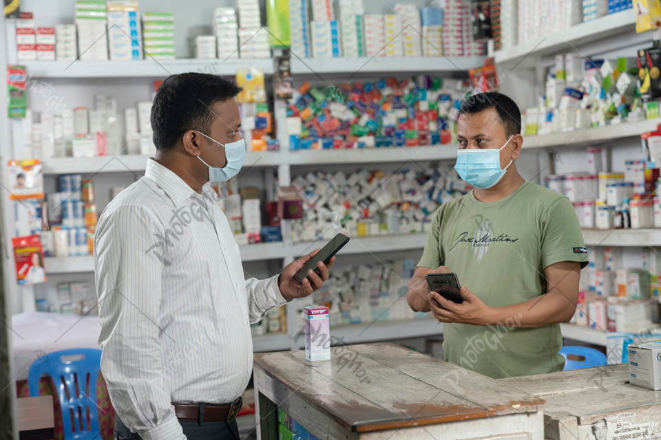 Pharmacy  salesman and customer using mobile apps