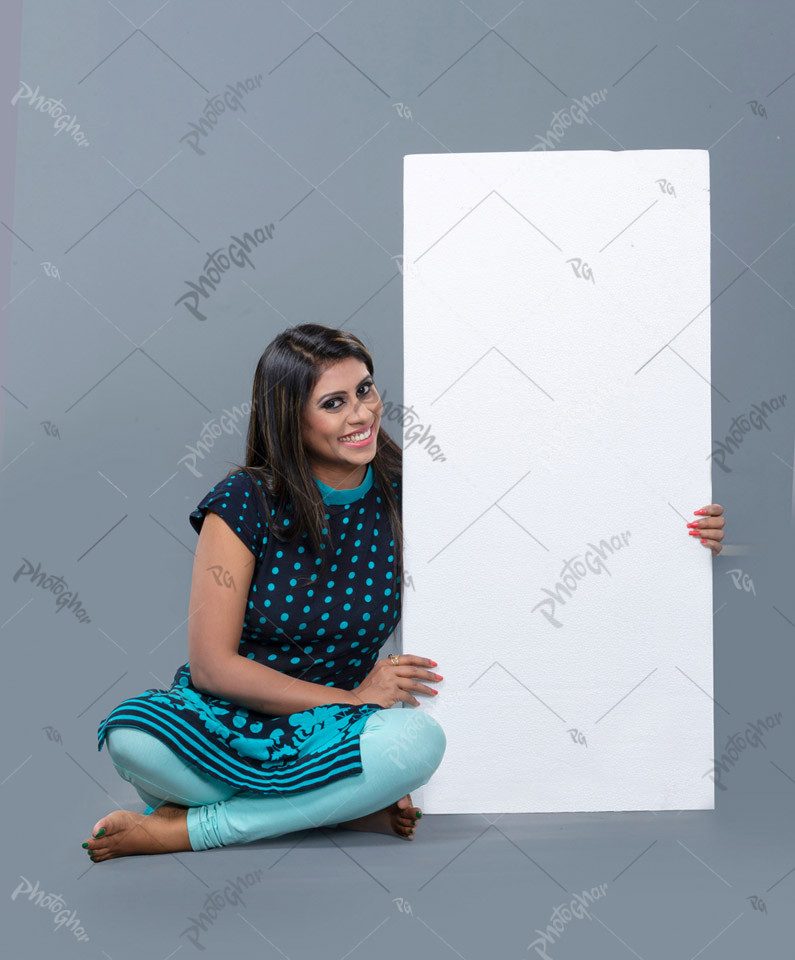 Polite young woman holding placard