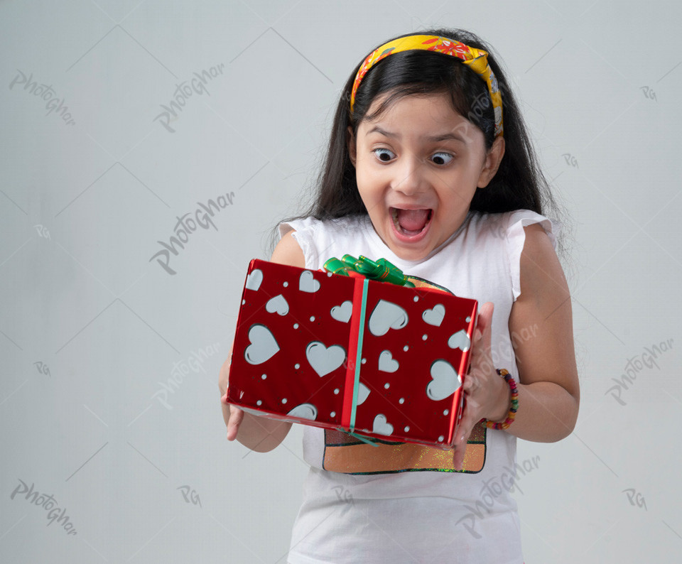 Portrait of a excited child getting gift box