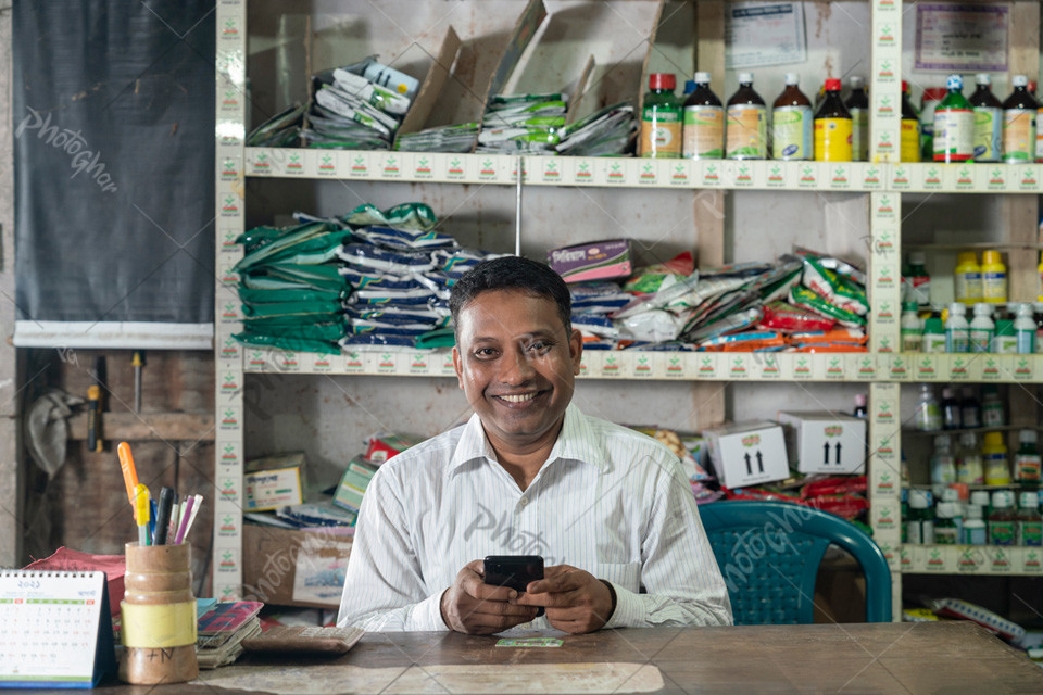 Portrait of a smiling male shopkeeper at seeds, fertilizers