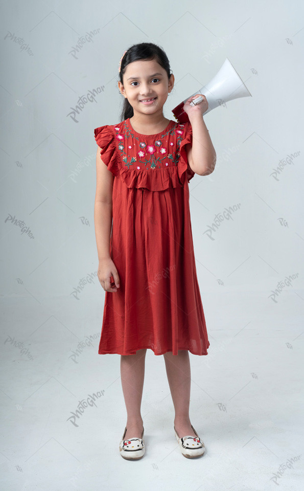 Portrait of beautiful South Asia kid ready to shouting