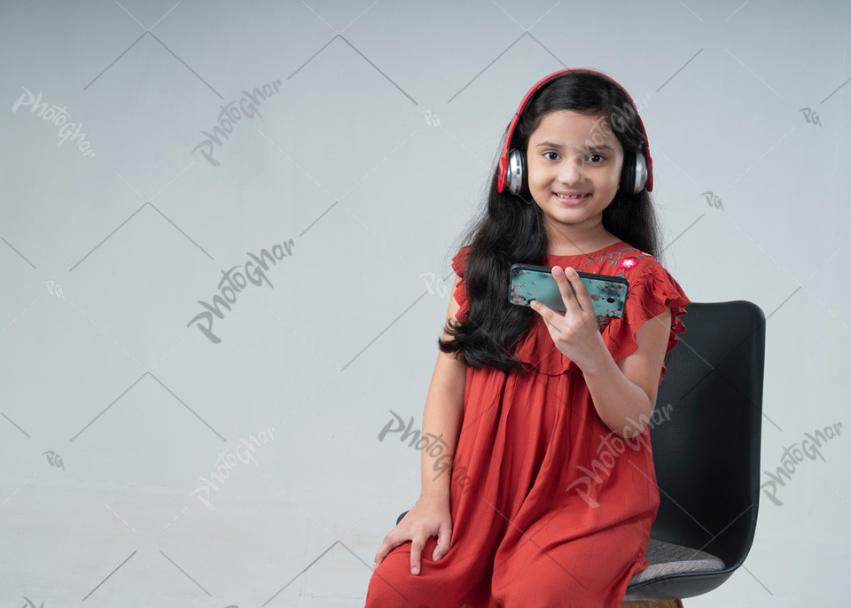 Portrait of excited kid wearing headphone