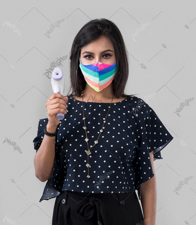 Protective masking wear woman holding thermometer