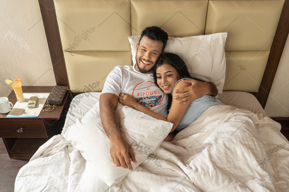 Romantic couple laying in hotel room