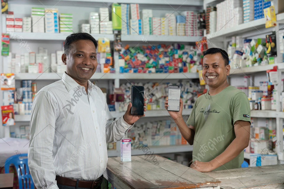 Salesman and customer showing online payment