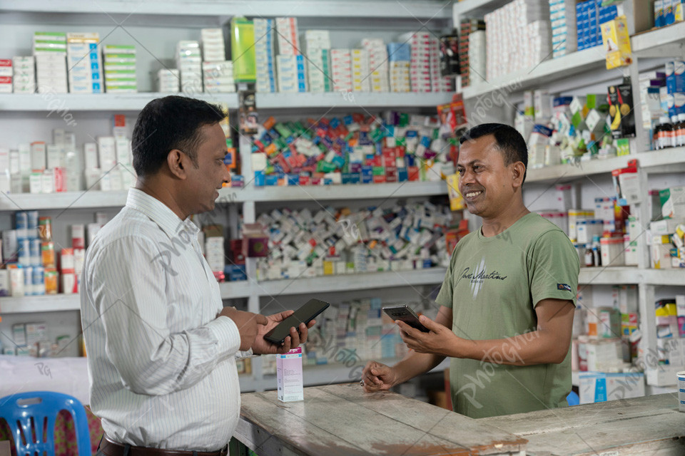 Salesman and customer using mobile apps